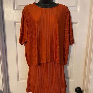 Burnt Orange Sz L comfy skirt and top set. Attached shorts. New with tags.